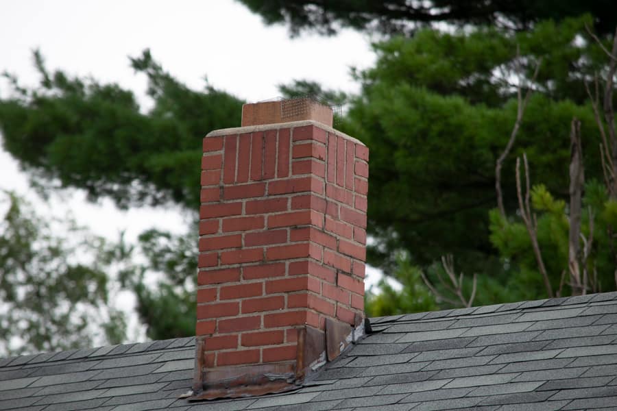 Repaired and repointed brick chimney stack
